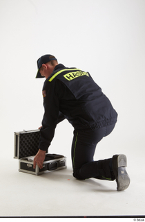 Sam Atkins Fireman Pose with Case kneeling whole body 0008.jpg